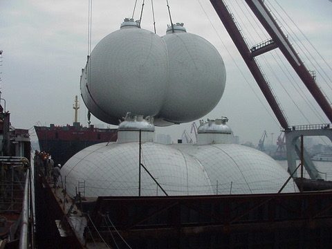 LPG cargo tanks being lifted into a hull at the shipyard